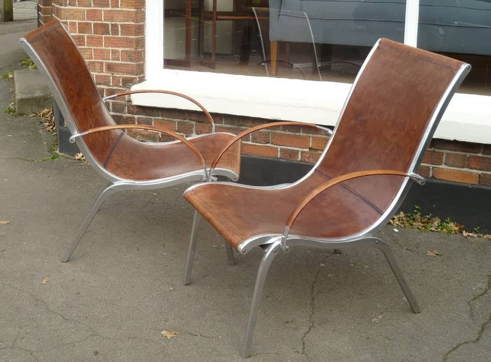 Mid-century aluminium and leather armchairs