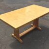 A 1930's Art Deco satin birch dining table with an extra leaf